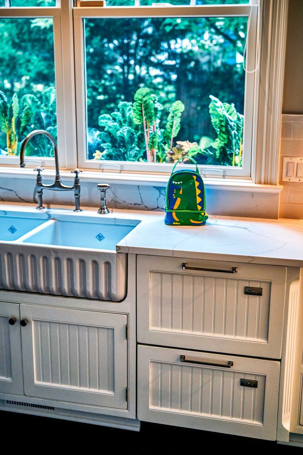 white painted cabinets and farm kitchen sink