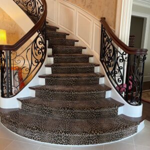 Animal print stair runner on curved princess staircase.png