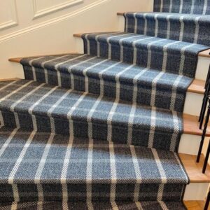 Beautiful grey stair runner with contrasting stripes in Hollywood style installation.png