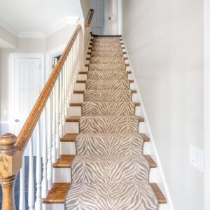 Contemporary animal print stair case in tan and cream.png
