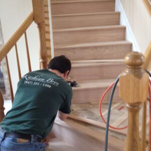 Kashian Bros employee building new wood stairs for home remodeling project