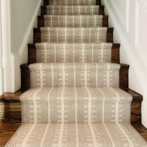 Neutral stair runner on wood stairs.png