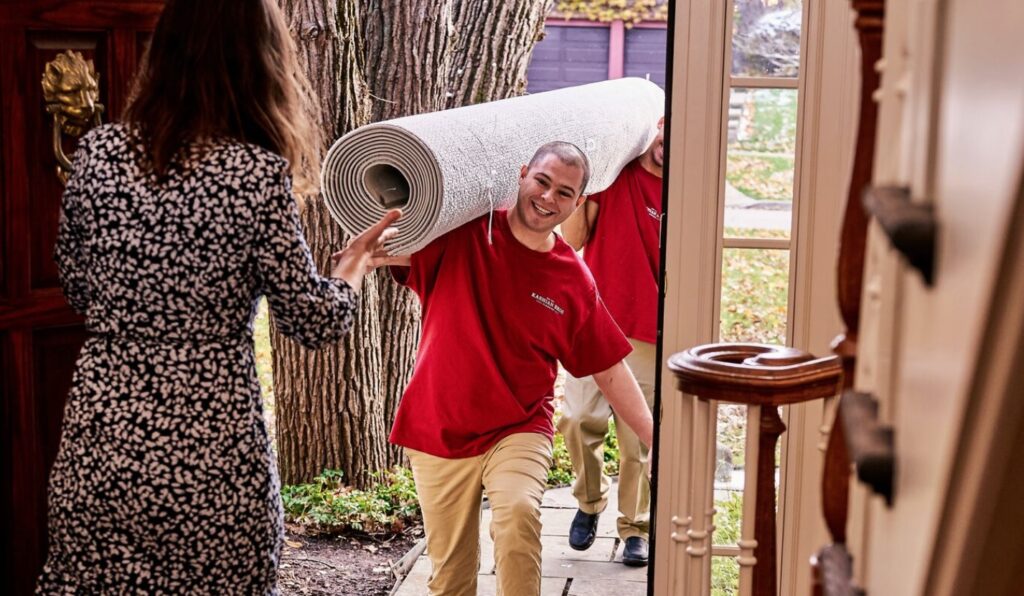 Man Delivering Rug Pick-Up and Delivery Service for Your Area Rugs